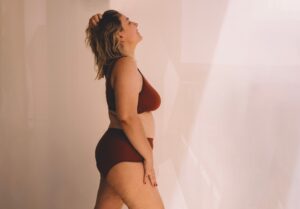 Confident young woman feeling positive and comfortable in her body.